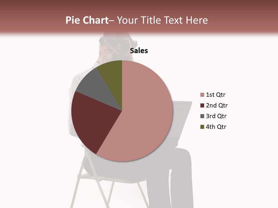 A Man Sitting On A Chair Using A Laptop Computer PowerPoint Template