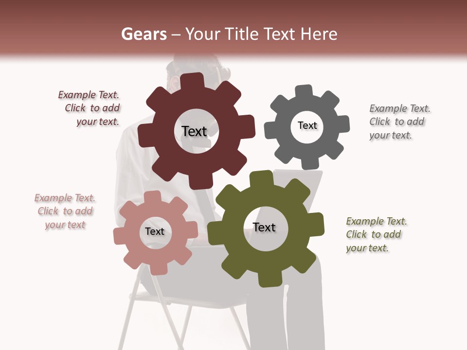 A Man Sitting On A Chair Using A Laptop Computer PowerPoint Template