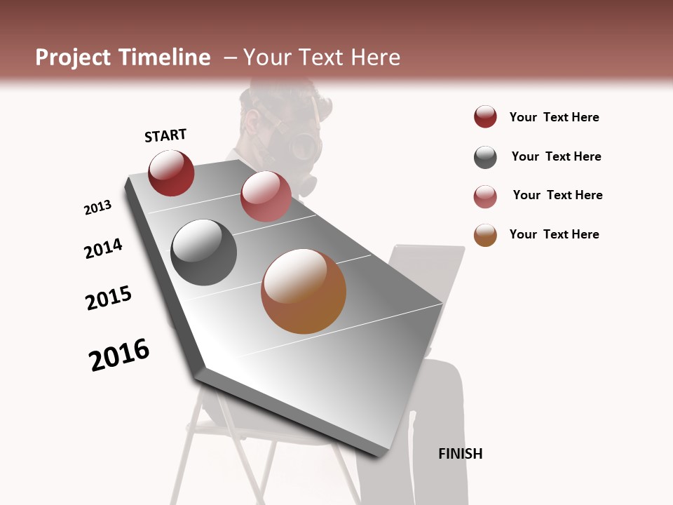 A Man Sitting On A Chair Using A Laptop Computer PowerPoint Template