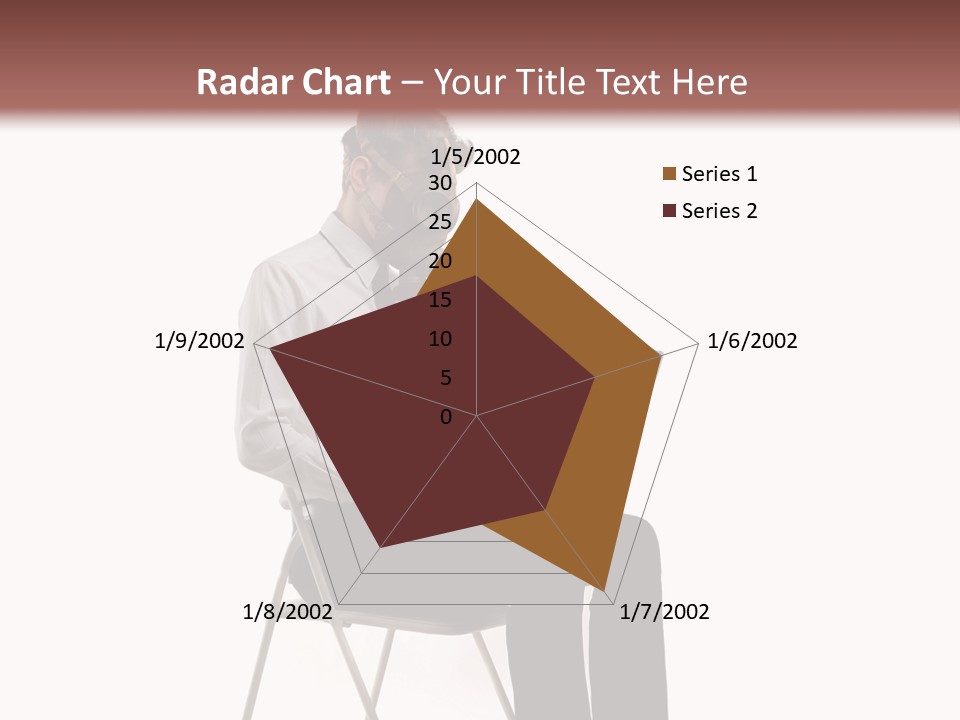 A Man Sitting On A Chair Using A Laptop Computer PowerPoint Template