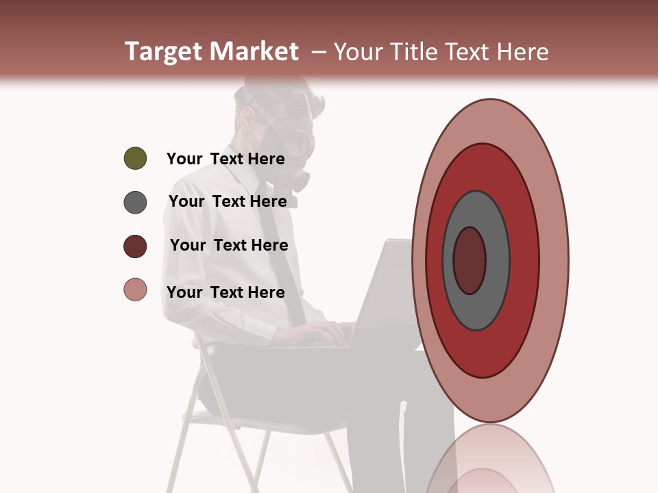 A Man Sitting On A Chair Using A Laptop Computer PowerPoint Template