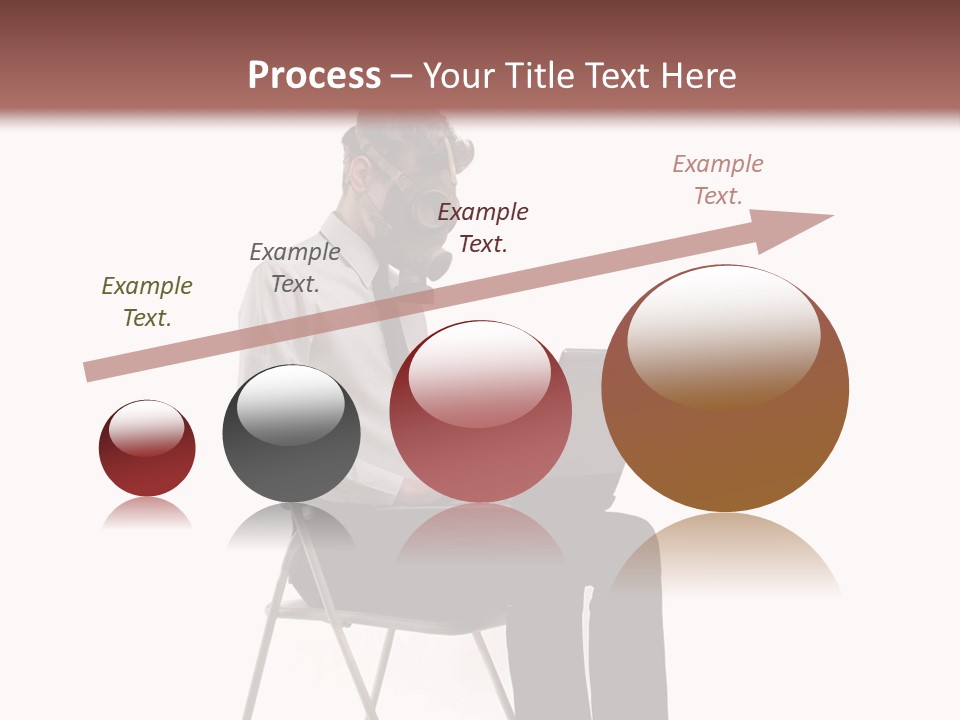 A Man Sitting On A Chair Using A Laptop Computer PowerPoint Template