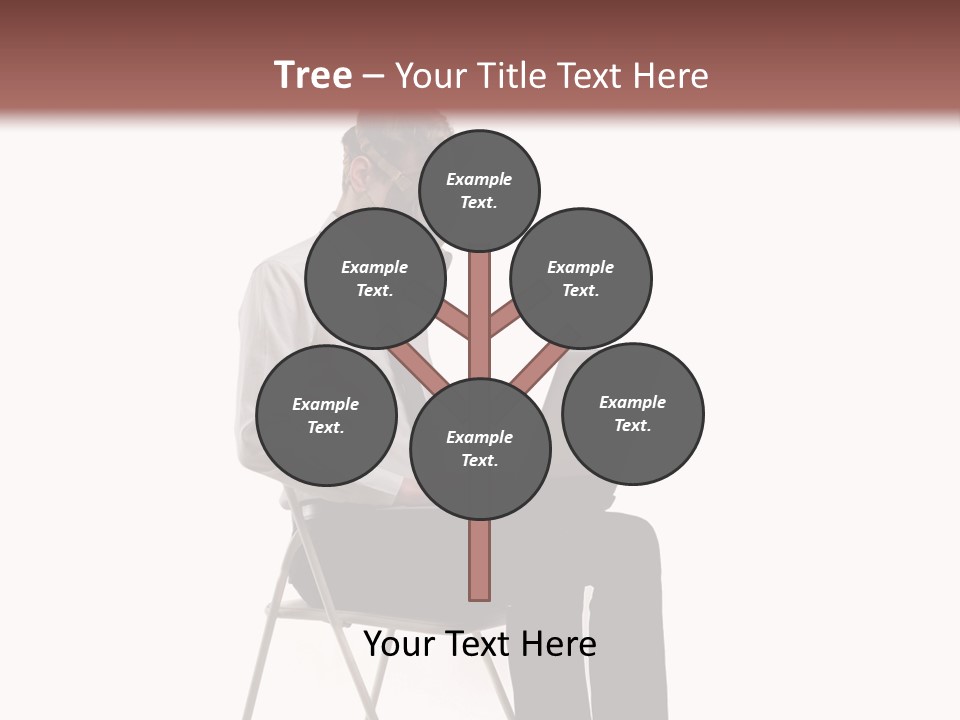A Man Sitting On A Chair Using A Laptop Computer PowerPoint Template