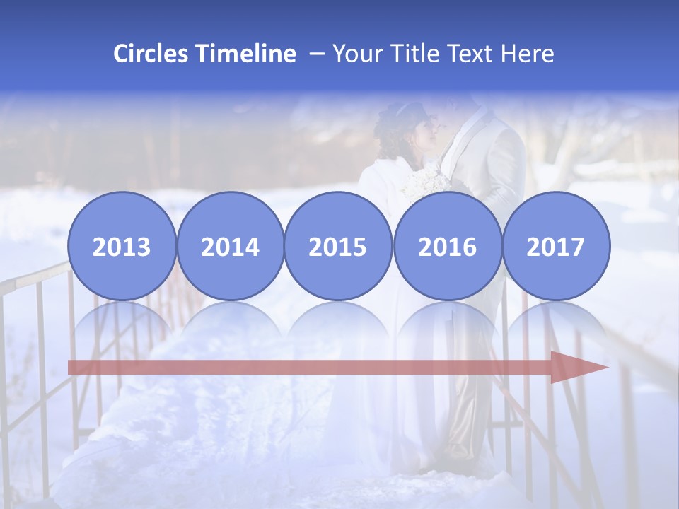 A Bride And Groom Standing On A Bridge In The Snow PowerPoint Template