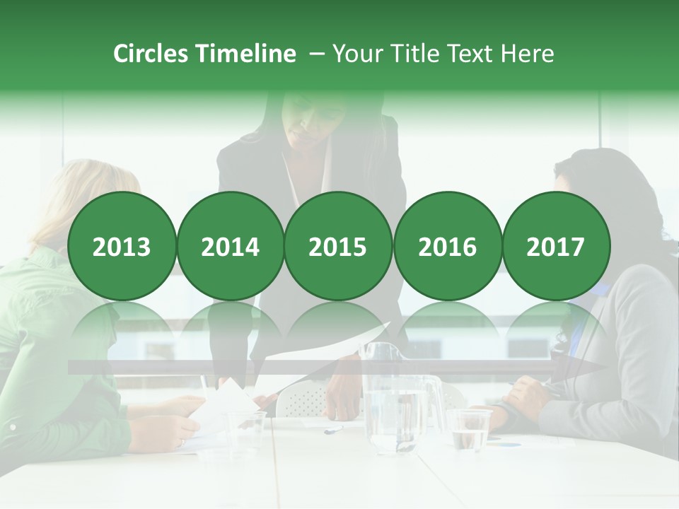 A Group Of Women Sitting Around A Table Talking PowerPoint Template