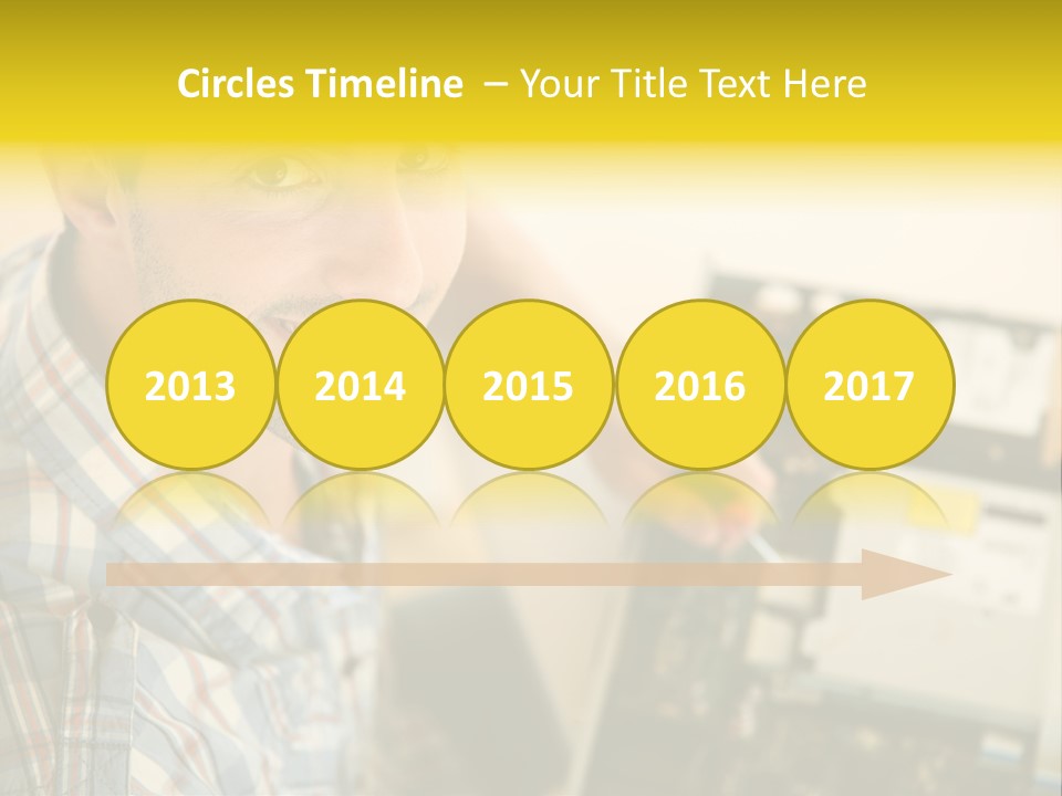 A Man Is Holding A Screw In Front Of A Circuit Board PowerPoint Template