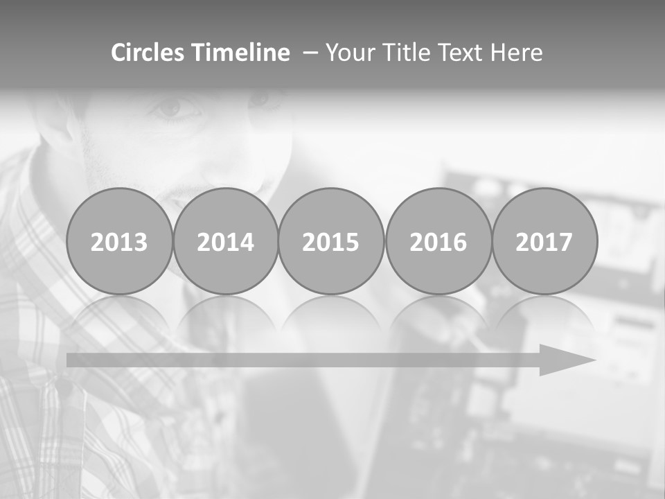 A Man Is Holding A Laptop Computer In His Hands PowerPoint Template