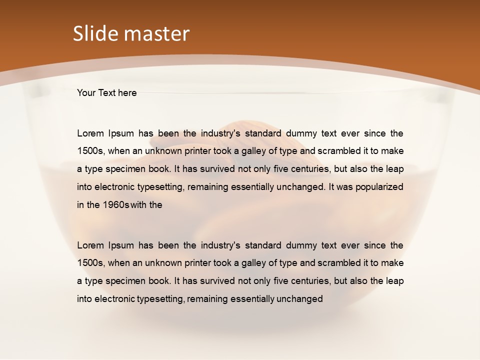 A Glass Bowl Filled With Almonds On Top Of A Table PowerPoint Template