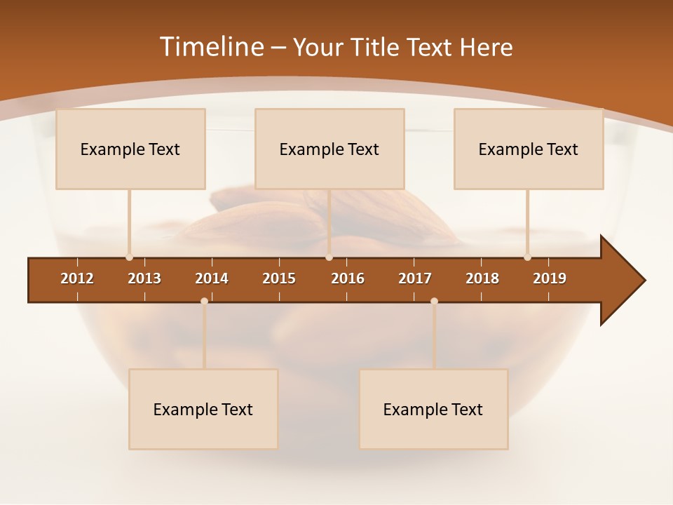 A Glass Bowl Filled With Almonds On Top Of A Table PowerPoint Template