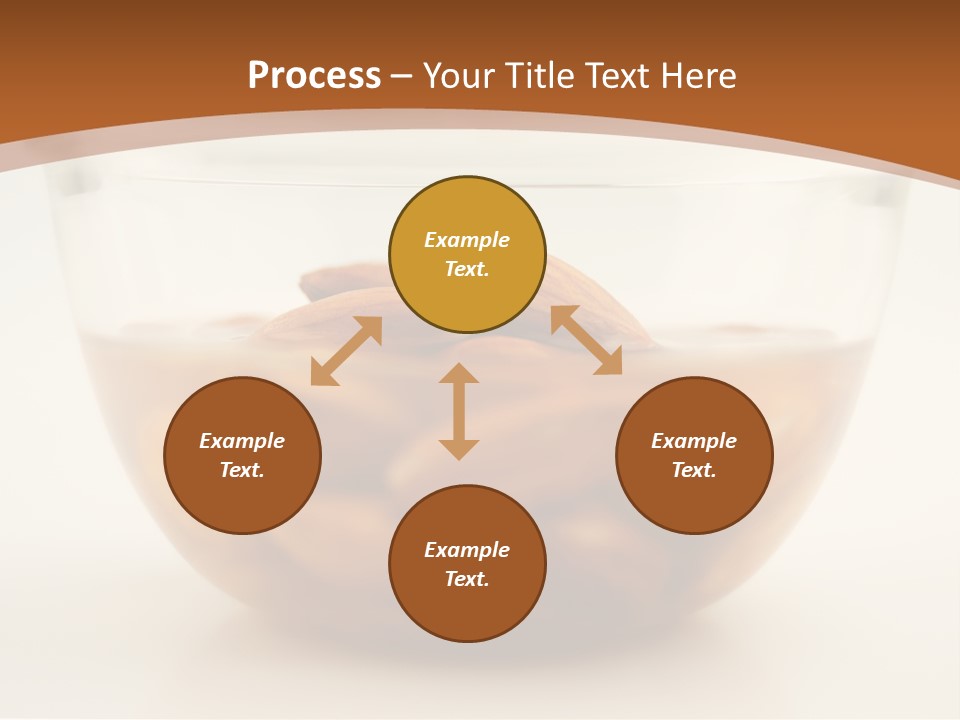A Glass Bowl Filled With Almonds On Top Of A Table PowerPoint Template