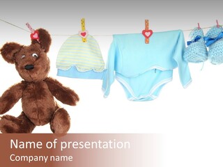 A Teddy Bear And Baby Clothes Hanging On A Clothes Line PowerPoint Template