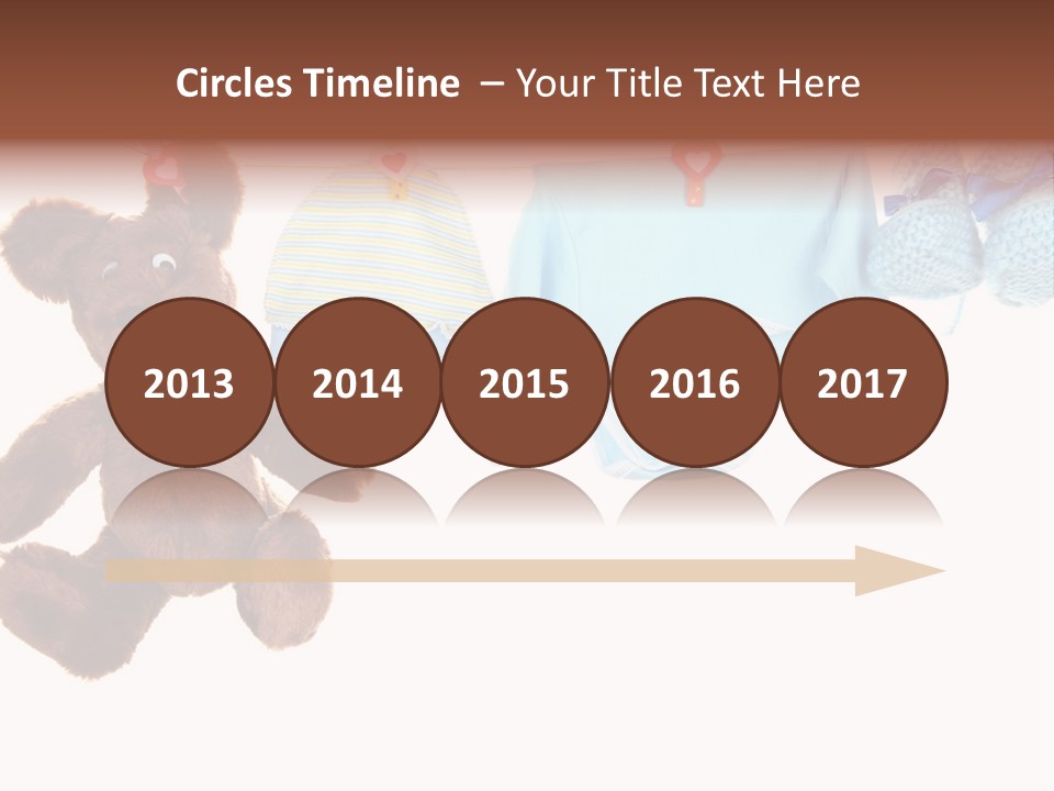 A Teddy Bear And Baby Clothes Hanging On A Clothes Line PowerPoint Template