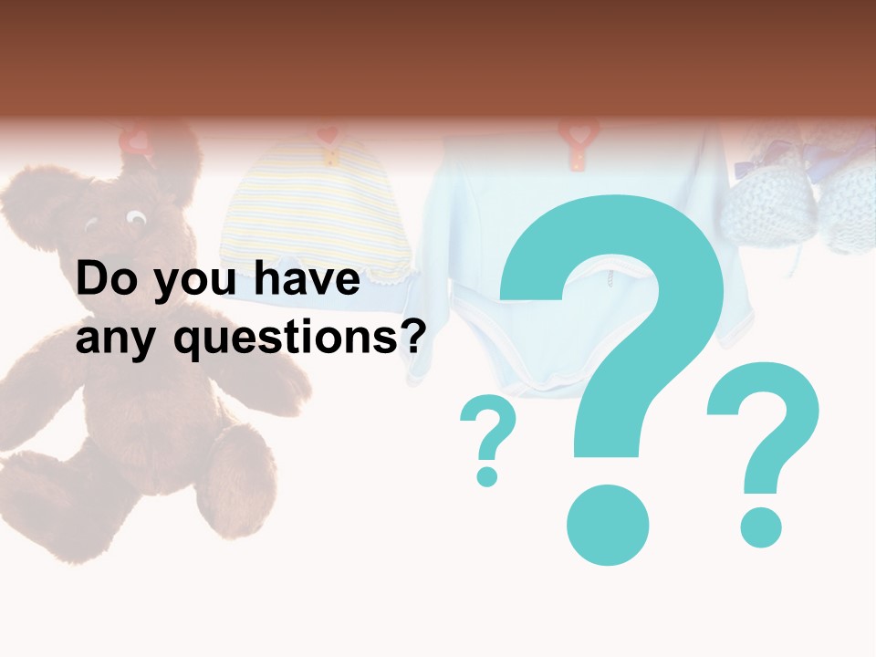 A Teddy Bear And Baby Clothes Hanging On A Clothes Line PowerPoint Template