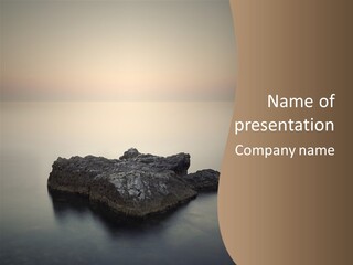 A Large Rock In The Middle Of A Body Of Water PowerPoint Template