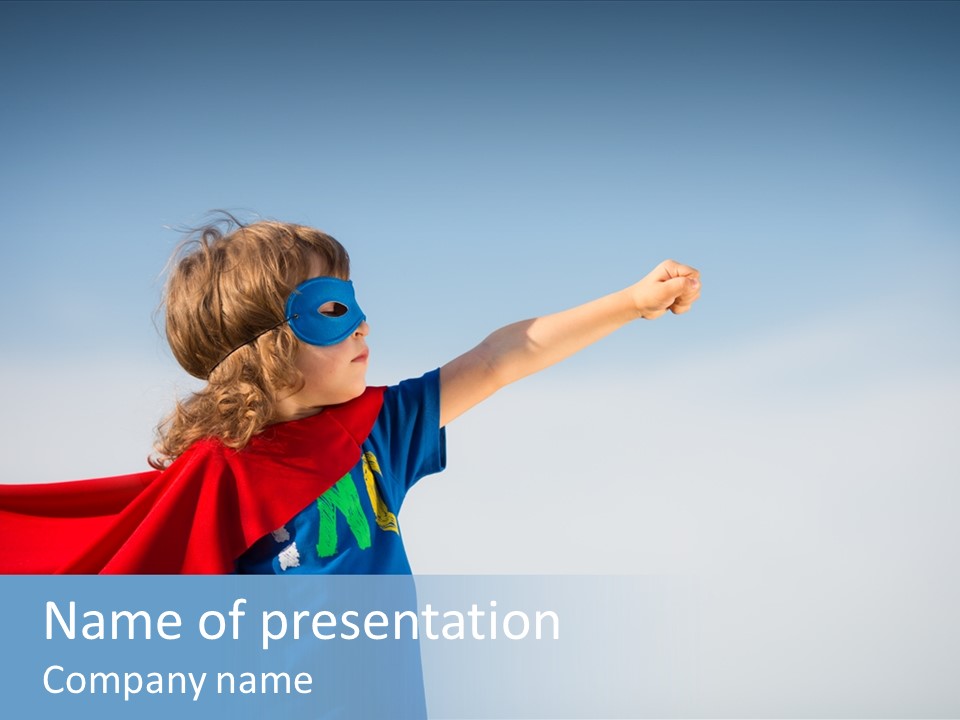 A Young Boy Dressed As A Super Hero PowerPoint Template