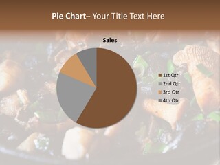 A Skillet Filled With Meat And Vegetables On Top Of A Table PowerPoint Template