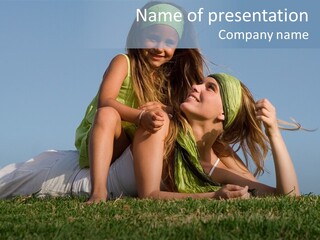 A Mother And Daughter Laying On The Grass PowerPoint Template