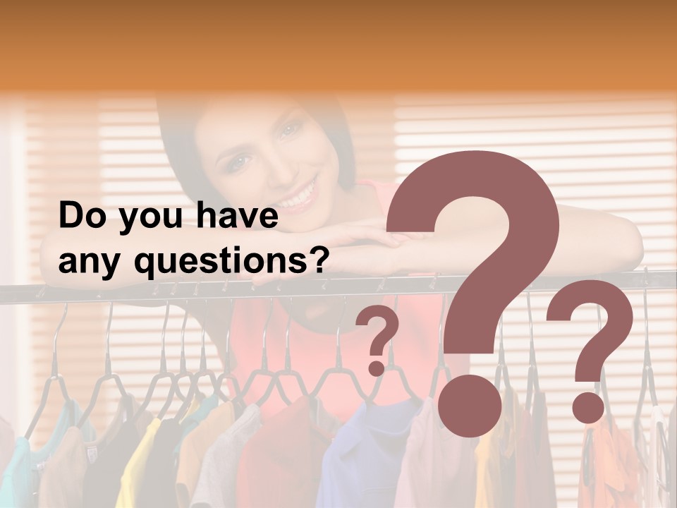 A Woman Standing In Front Of A Rack Of Clothes PowerPoint Template