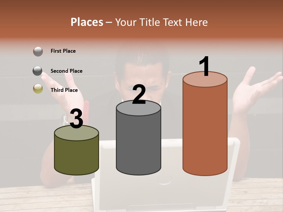 A Man Sitting In Front Of A Laptop Computer PowerPoint Template