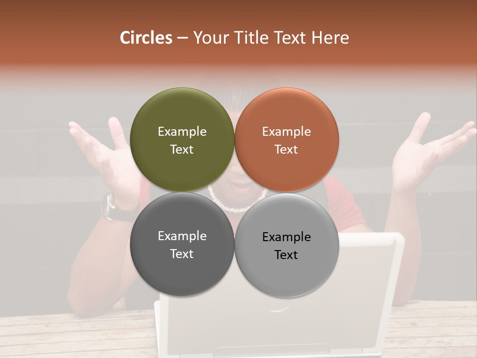 A Man Sitting In Front Of A Laptop Computer PowerPoint Template