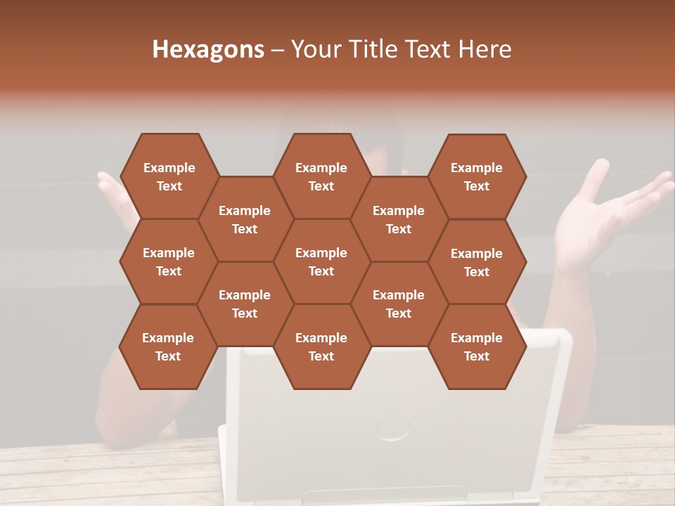 A Man Sitting In Front Of A Laptop Computer PowerPoint Template