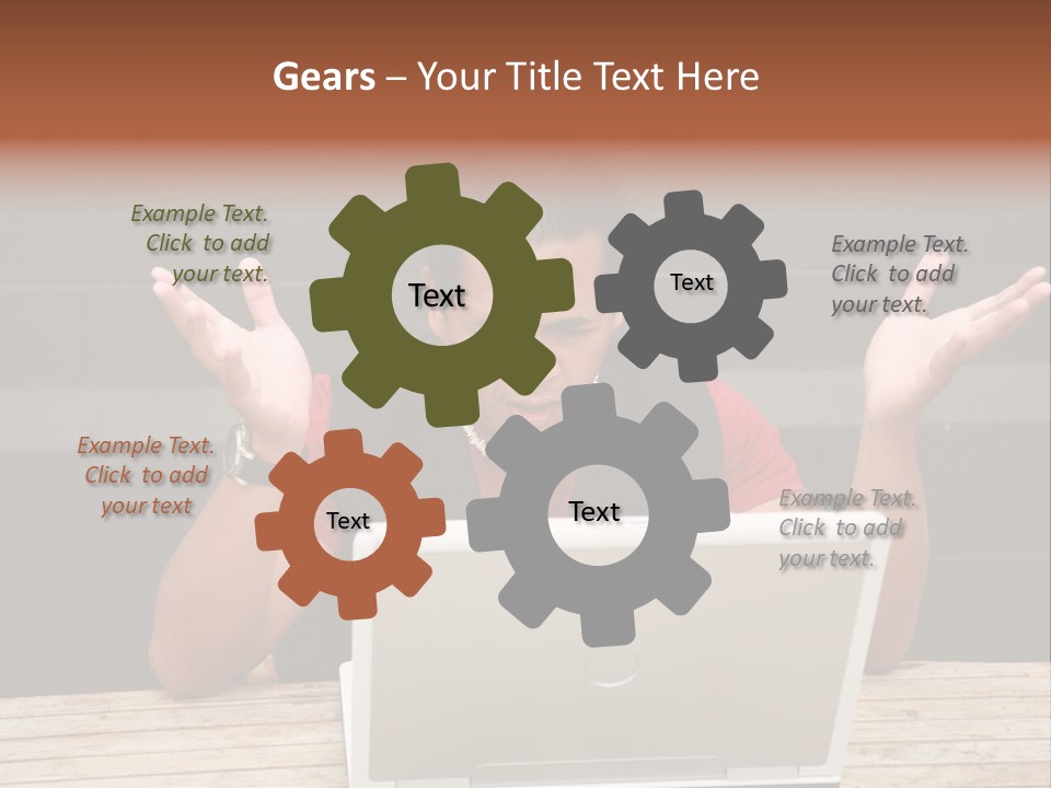 A Man Sitting In Front Of A Laptop Computer PowerPoint Template