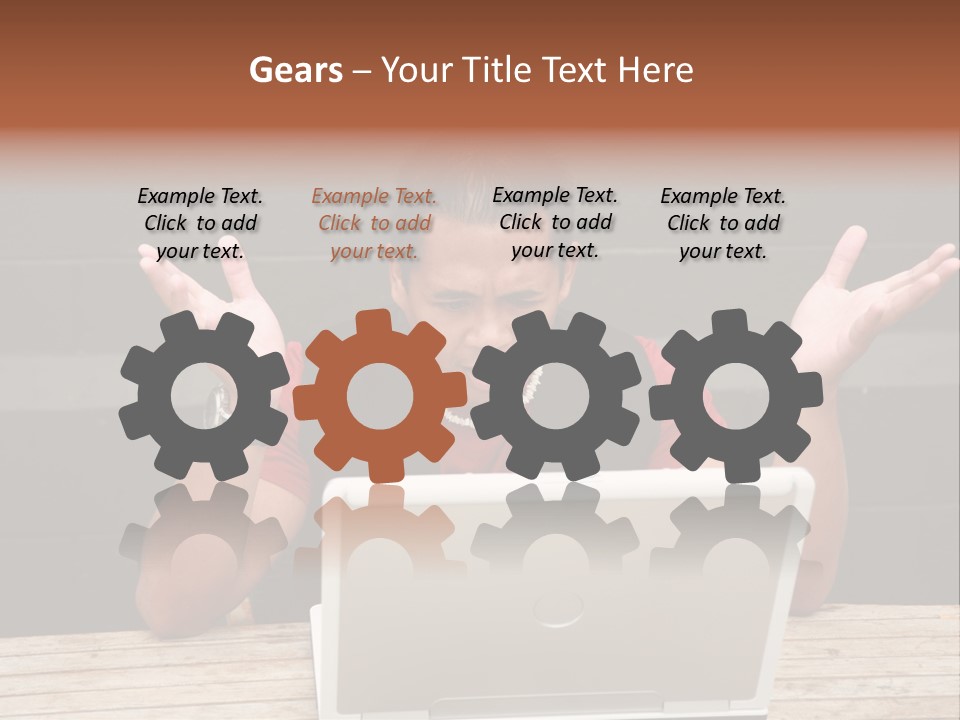 A Man Sitting In Front Of A Laptop Computer PowerPoint Template