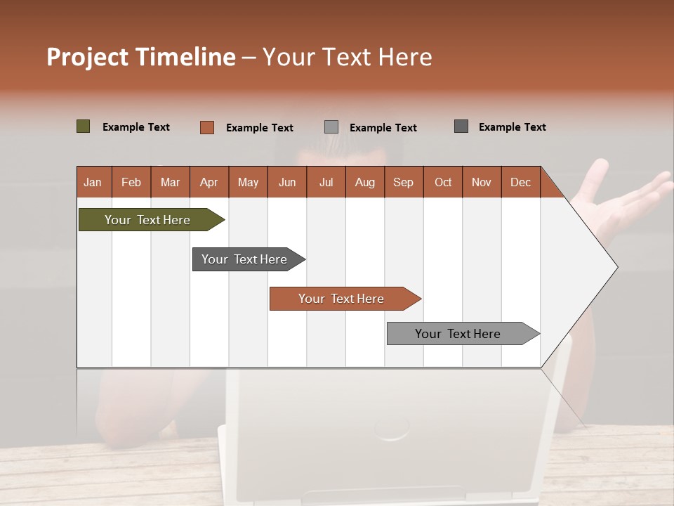 A Man Sitting In Front Of A Laptop Computer PowerPoint Template
