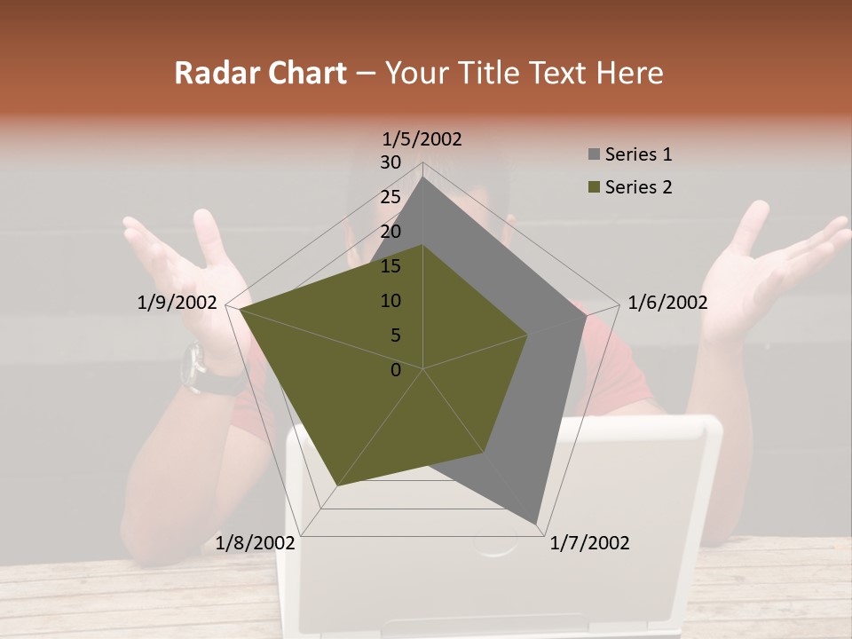 A Man Sitting In Front Of A Laptop Computer PowerPoint Template
