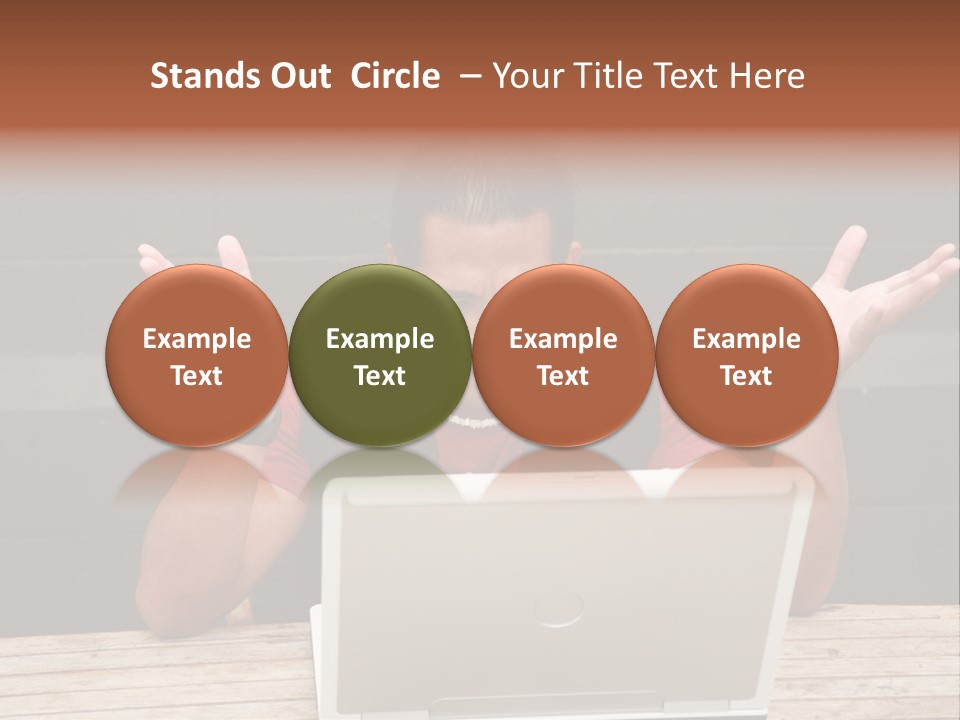 A Man Sitting In Front Of A Laptop Computer PowerPoint Template