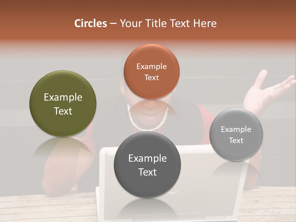 A Man Sitting In Front Of A Laptop Computer PowerPoint Template