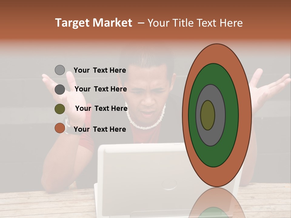 A Man Sitting In Front Of A Laptop Computer PowerPoint Template