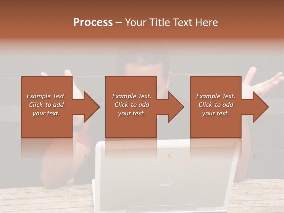 A Man Sitting In Front Of A Laptop Computer PowerPoint Template