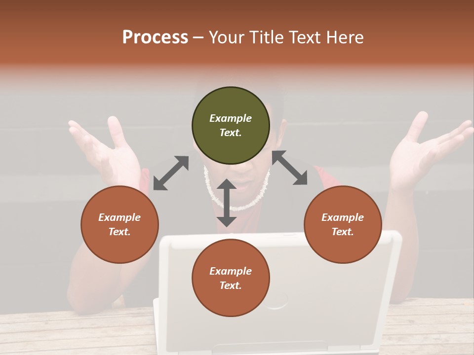 A Man Sitting In Front Of A Laptop Computer PowerPoint Template
