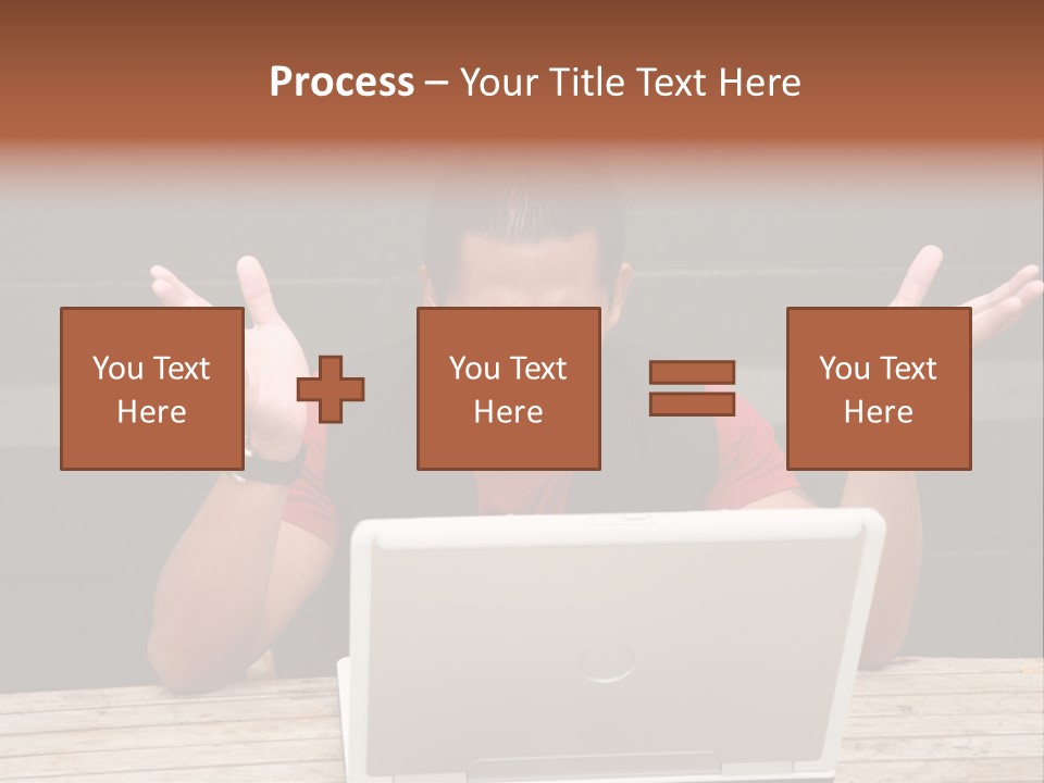 A Man Sitting In Front Of A Laptop Computer PowerPoint Template