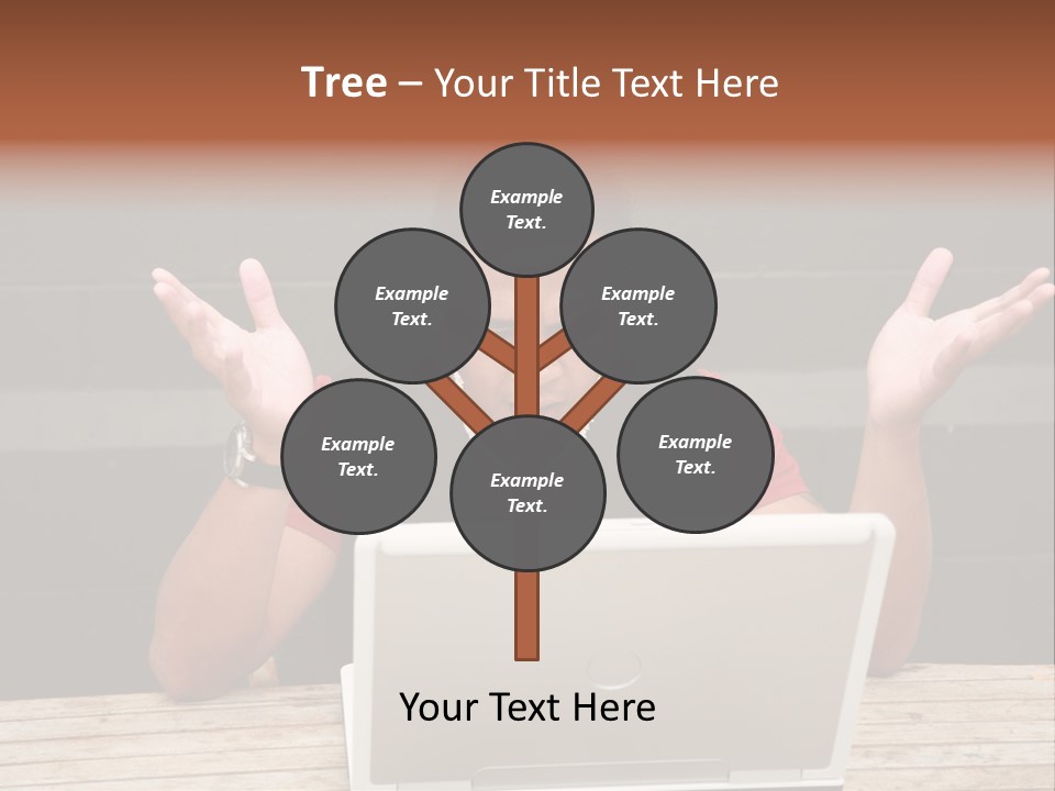 A Man Sitting In Front Of A Laptop Computer PowerPoint Template