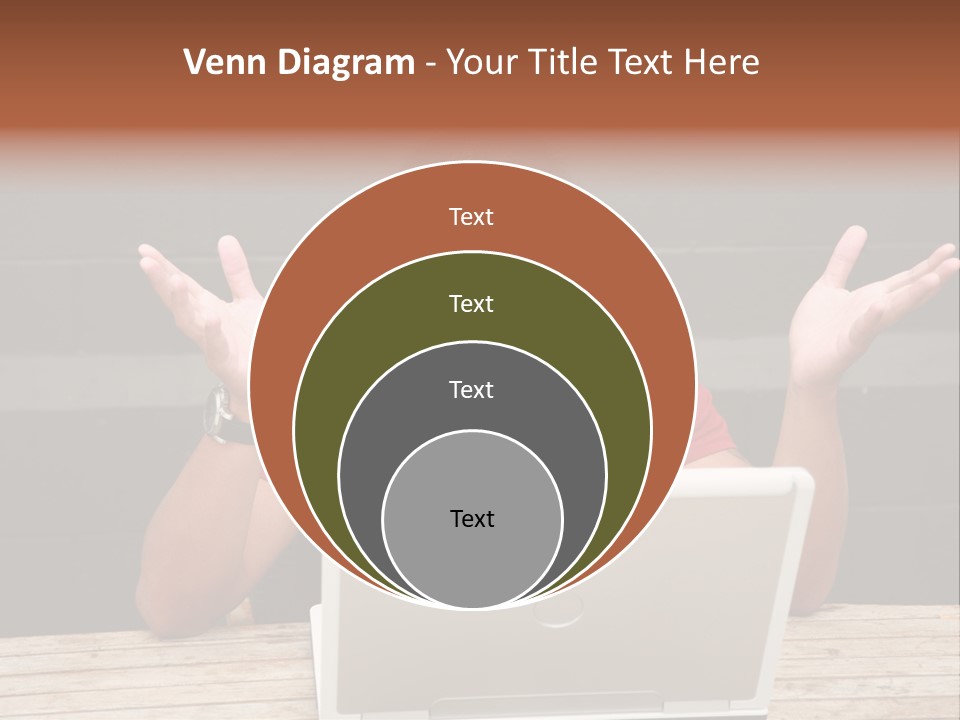 A Man Sitting In Front Of A Laptop Computer PowerPoint Template