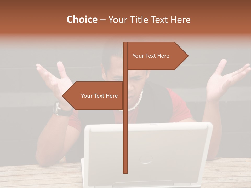 A Man Sitting In Front Of A Laptop Computer PowerPoint Template