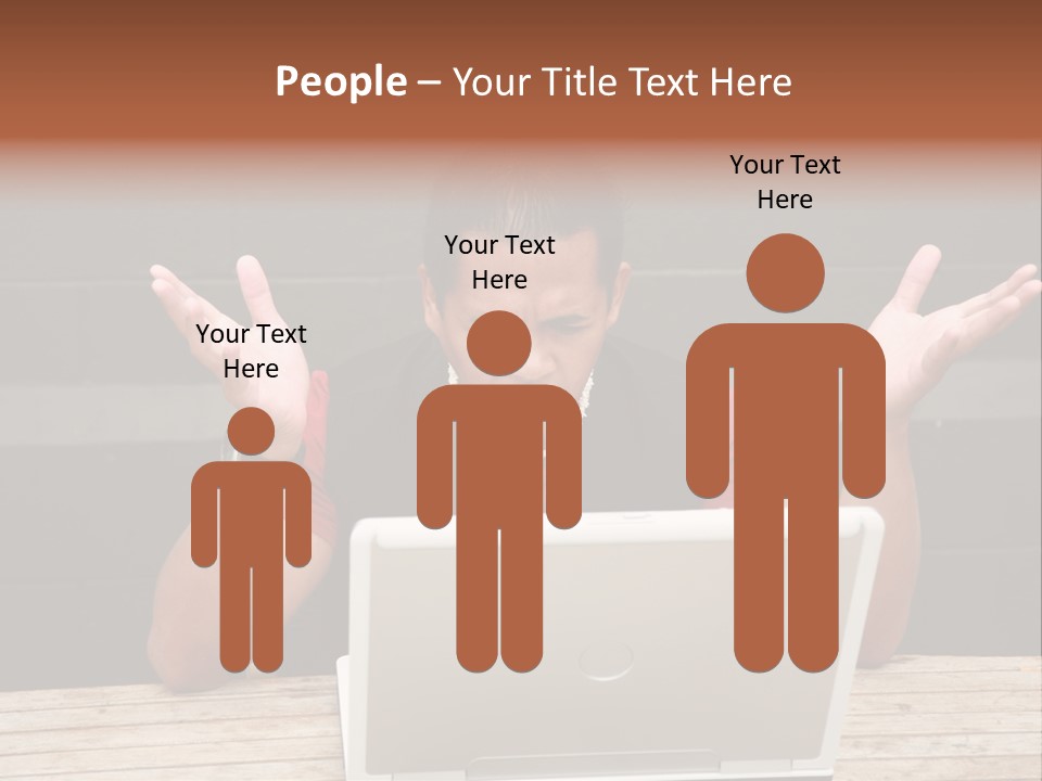 A Man Sitting In Front Of A Laptop Computer PowerPoint Template