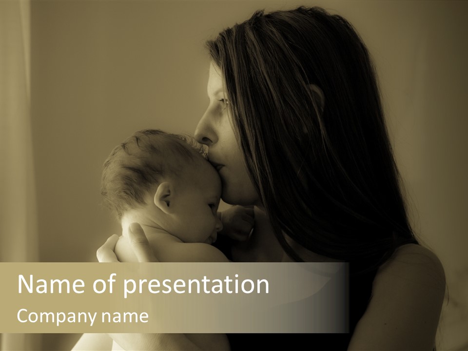 A Woman Holding A Baby In Her Arms PowerPoint Template