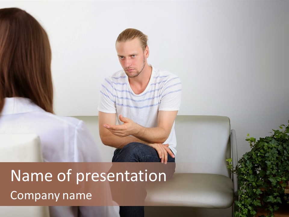 A Man Sitting On A Couch Talking To A Woman PowerPoint Template