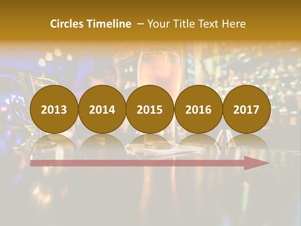 A Glass Of Beer Sitting On Top Of A Table PowerPoint Template