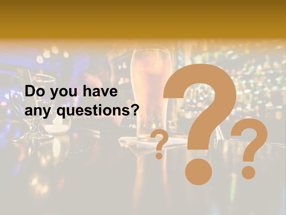 A Glass Of Beer Sitting On Top Of A Table PowerPoint Template