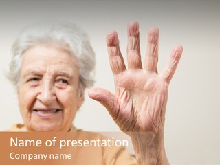 An Elderly Woman Holding Her Hand Up In The Air PowerPoint Template