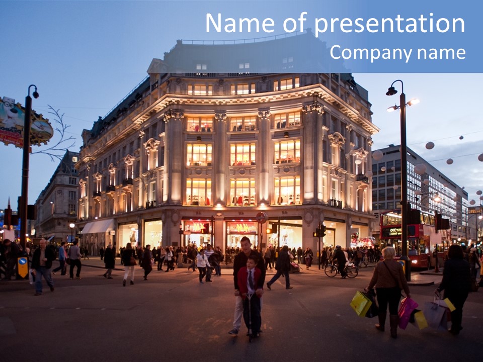 A Group Of People Walking Across A Street In Front Of A Building PowerPoint Template