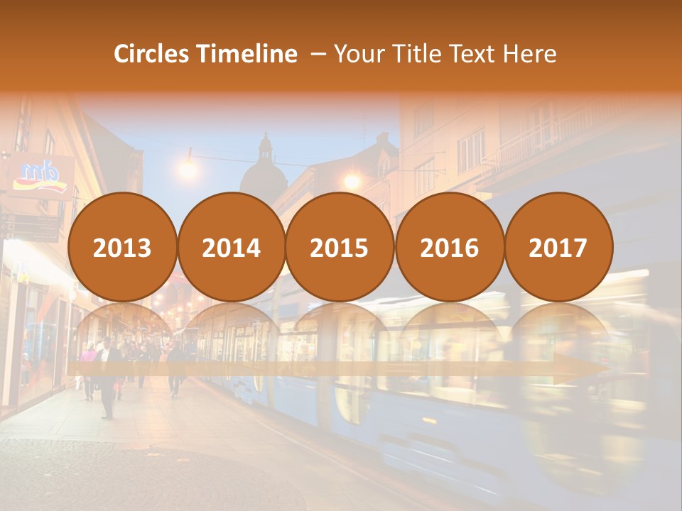 A Blue Train Traveling Down A Street Next To Tall Buildings PowerPoint Template