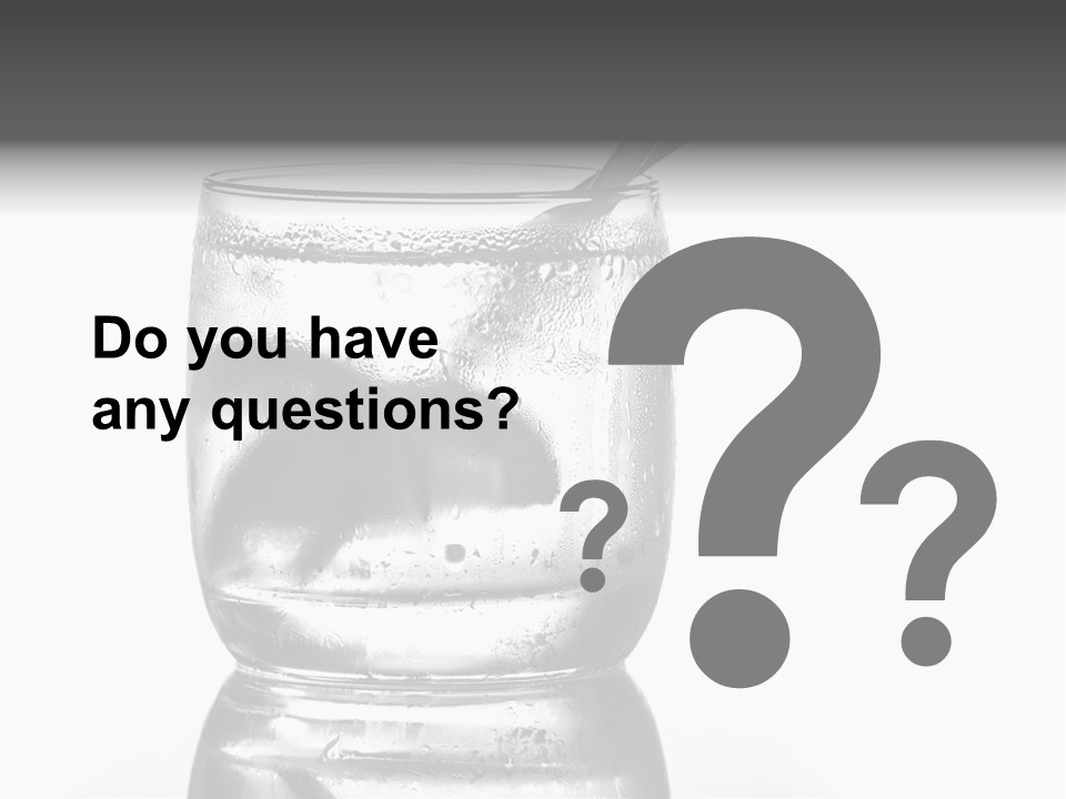 A Glass Of Water With A Spoon In It PowerPoint Template