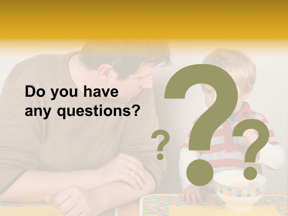 A Man And A Young Boy Sitting At A Table With A Bowl Of Food PowerPoint Template