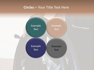 A Man In A Wheelchair Holding The Wheel Of A Wheel Chair PowerPoint Template