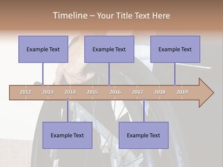 A Man In A Wheelchair Holding The Wheel Of A Wheel Chair PowerPoint Template